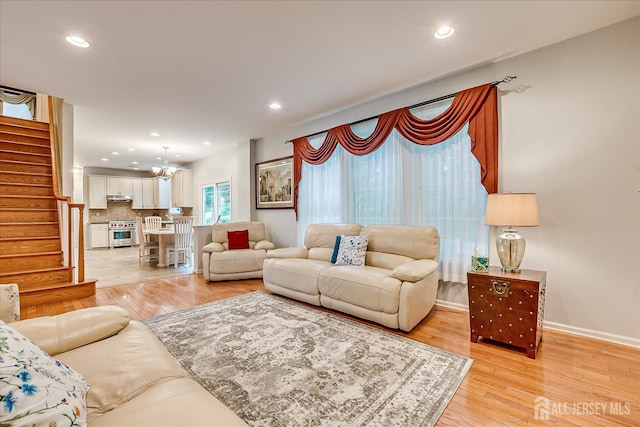 35 Fabiszewski Way, Parlin, NJ 08859 - living area featuring stairway, light wood-type flooring, recessed lighting, baseboards, and a chandelier
