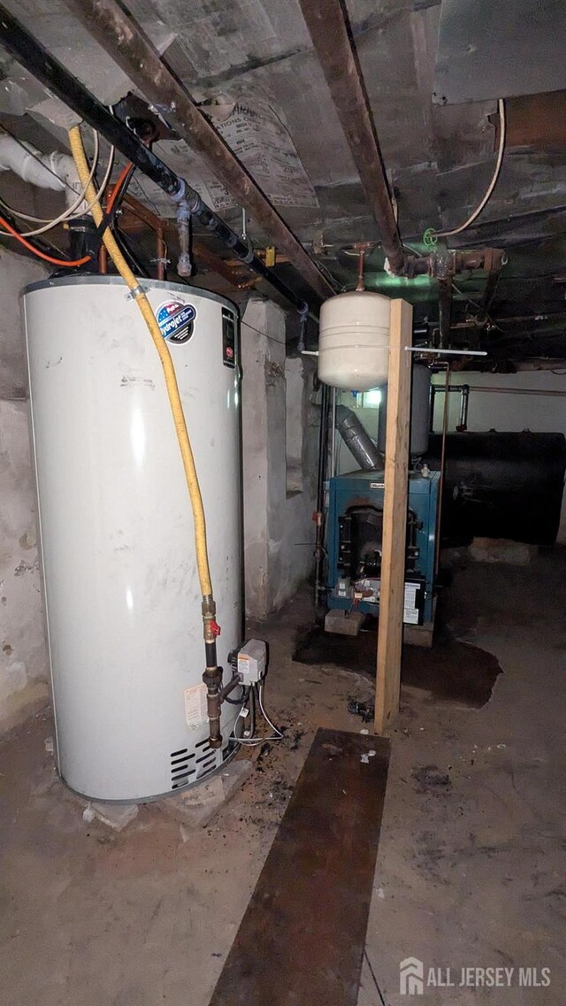 810-814 Leland Ave, Plainfield, NJ 07062 - unfinished below grade area featuring gas water heater, oil tank, and a heating unit