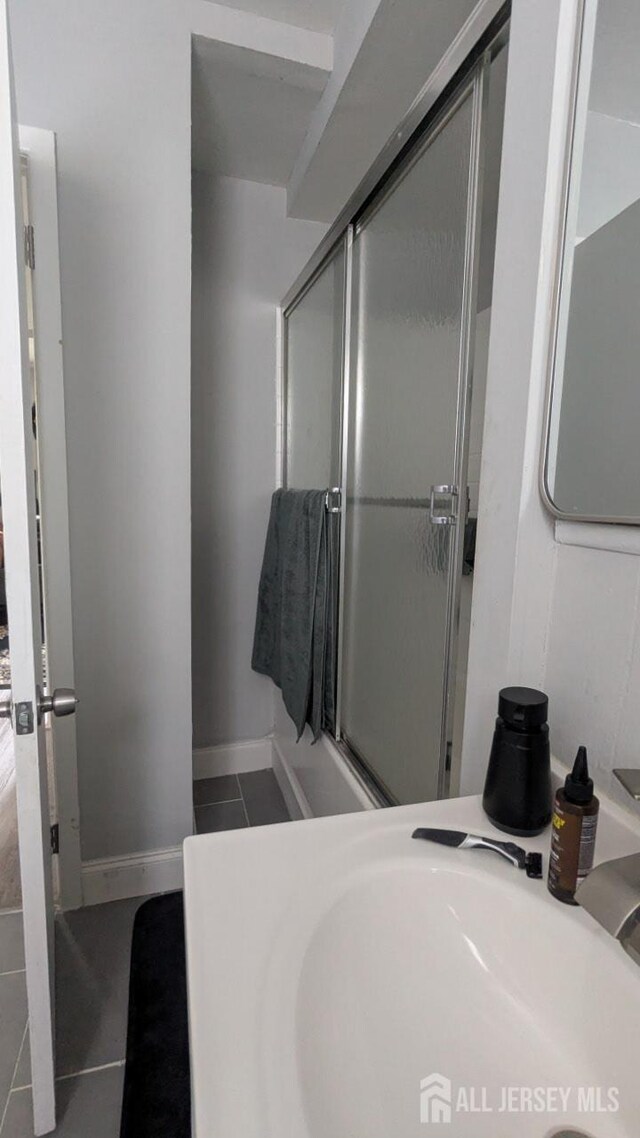 810-814 Leland Ave, Plainfield, NJ 07062 - full bathroom featuring tile patterned flooring and a shower with door