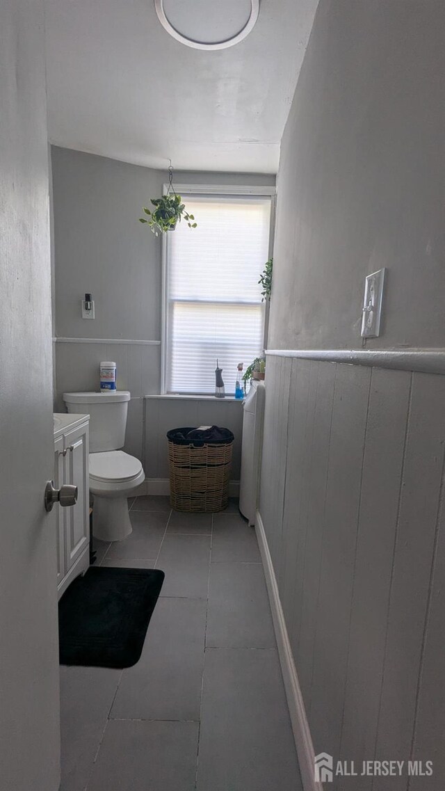 810-814 Leland Ave, Plainfield, NJ 07062 - bathroom with wainscoting, tile patterned flooring, and vanity