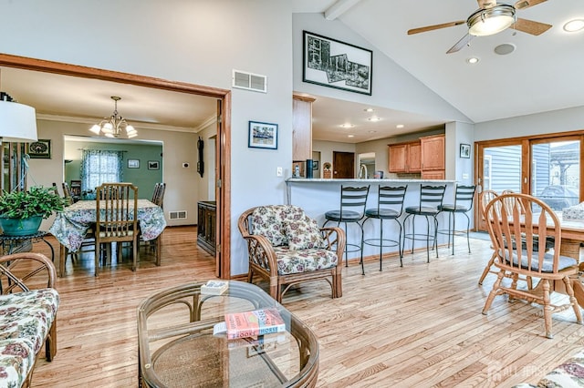 living room with visible vents, high vaulted ceiling, light wood-style floors, beamed ceiling, and ceiling fan with notable chandelier