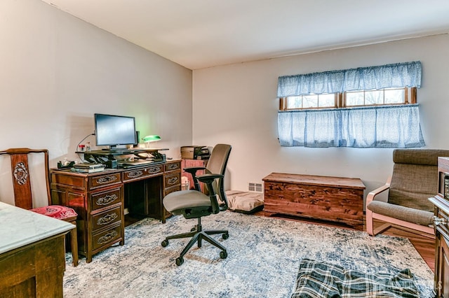 office area with visible vents and wood finished floors