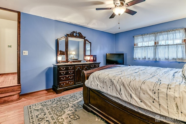 bedroom with wood finished floors and ceiling fan