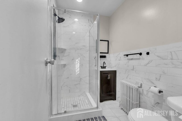 full bath featuring toilet, a shower stall, radiator, and vanity