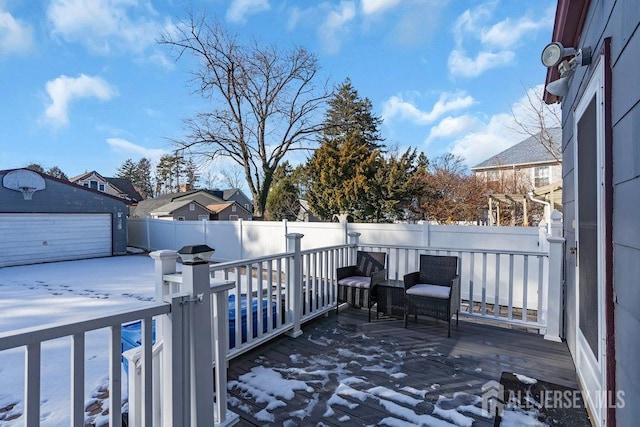 wooden deck with a fenced backyard and an outdoor structure