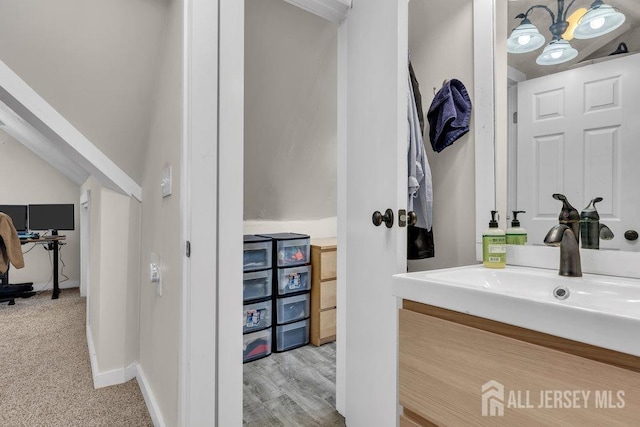 bathroom featuring vanity and baseboards