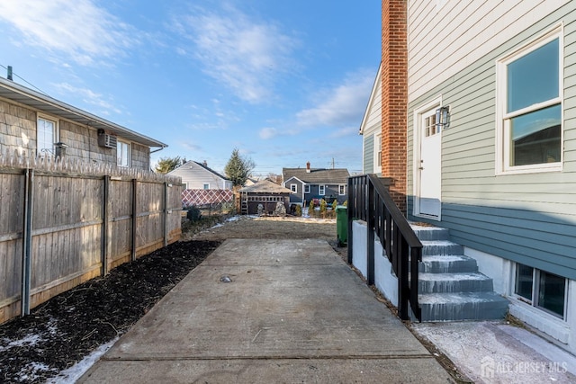 exterior space with a patio area and fence