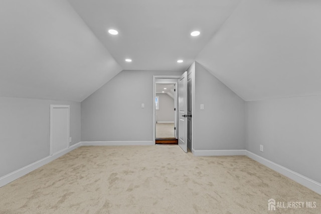 bonus room featuring recessed lighting, lofted ceiling, carpet, and baseboards