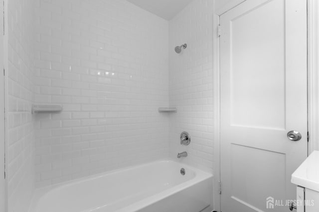 full bathroom with bathtub / shower combination and vanity