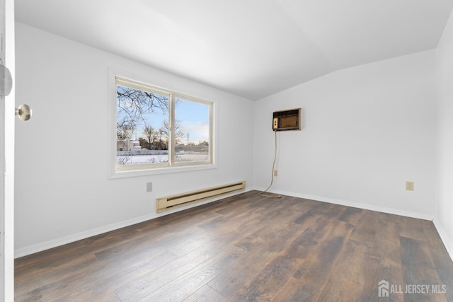 unfurnished room with baseboards, lofted ceiling, wood finished floors, a wall mounted air conditioner, and a baseboard heating unit