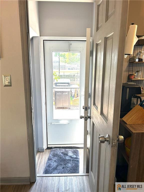 133 Pleasant Ave, Iselin, NJ 08830 - entryway featuring wood finished floors and baseboards