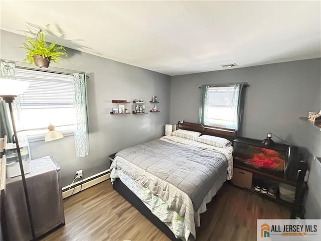133 Pleasant Ave, Iselin, NJ 08830 - bedroom featuring baseboard heating and wood finished floors
