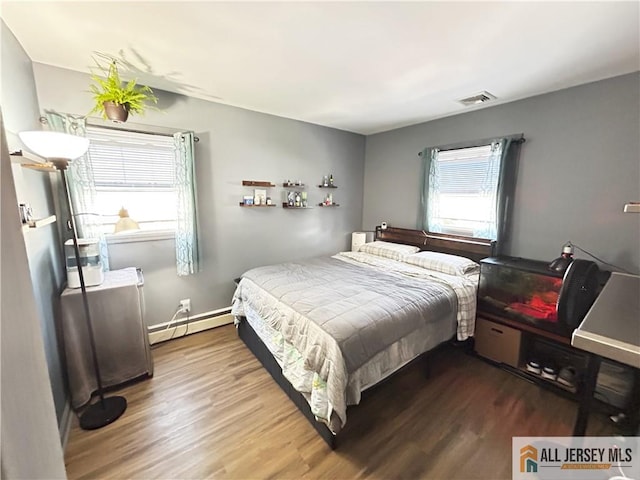 133 Pleasant Ave, Iselin, NJ 08830 - bedroom with baseboard heating and wood finished floors