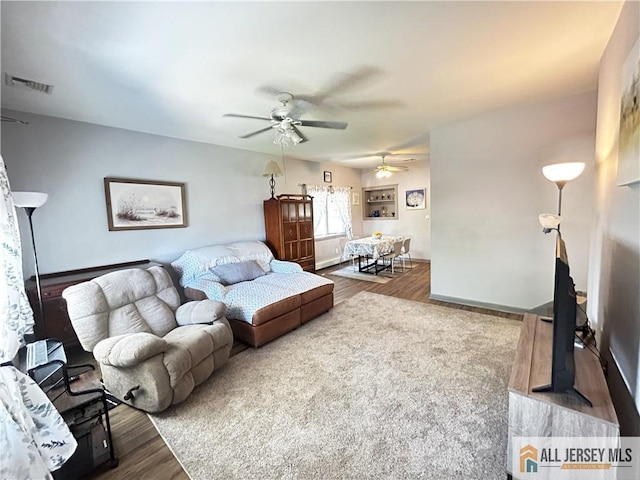 133 Pleasant Ave, Iselin, NJ 08830 - living area featuring a ceiling fan, wood finished floors, and baseboards