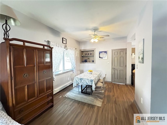 133 Pleasant Ave, Iselin, NJ 08830 - dining space with a baseboard heating unit, ceiling fan, dark wood finished floors, and baseboards