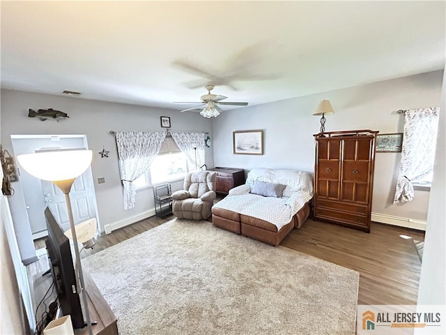 133 Pleasant Ave, Iselin, NJ 08830 - living room featuring a ceiling fan, wood finished floors, baseboards, and baseboard heating
