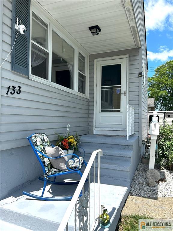 133 Pleasant Ave, Iselin, NJ 08830 - entrance to property featuring covered porch