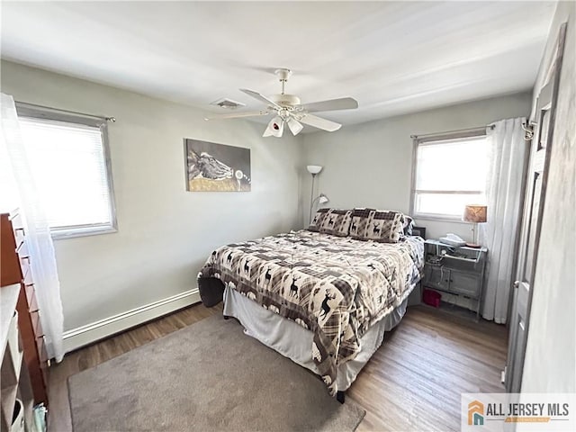 133 Pleasant Ave, Iselin, NJ 08830 - bedroom featuring wood finished floors, ceiling fan, and baseboards