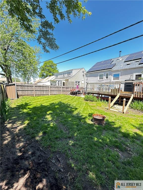 133 Pleasant Ave, Iselin, NJ 08830 - view of yard with a fire pit and a wooden deck