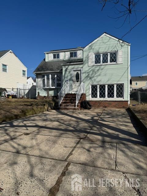 split level home with fence