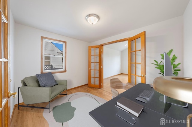 office with french doors and wood-type flooring