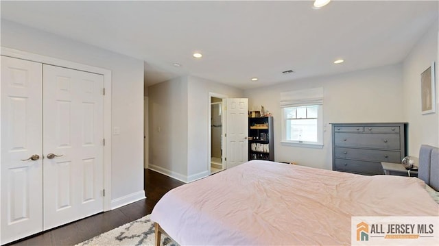 bedroom with dark wood-style floors, recessed lighting, and baseboards