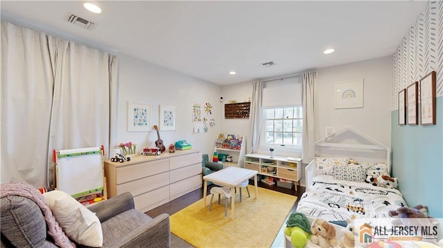 bedroom featuring visible vents and recessed lighting