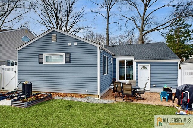 624 Lyman Ave, Woodbridge Proper, NJ 07095 - rear view of property featuring a patio area, a garage, a garden, and roof with shingles