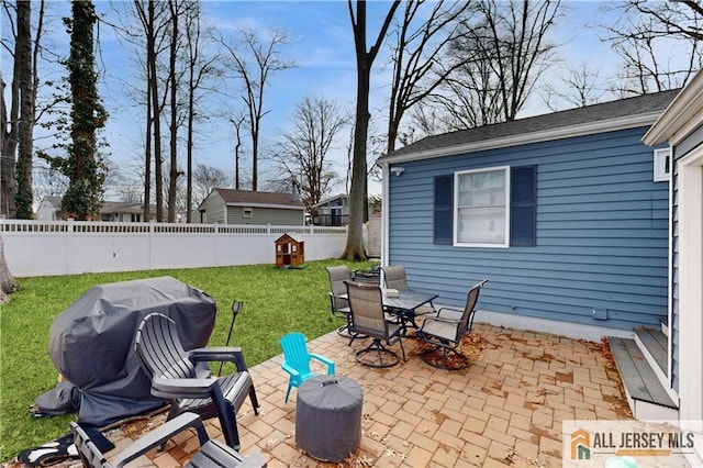 view of patio / terrace with outdoor dining area, a grill, and a fenced backyard