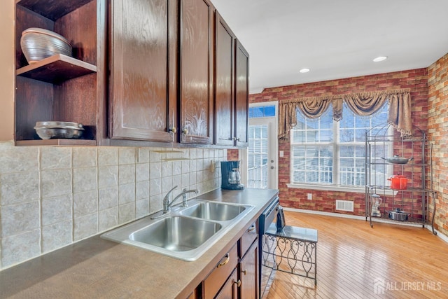 1 Kushnetki Rd, Parlin, NJ 08859 - kitchen with light wood-type flooring, open shelves, brick wall, tasteful backsplash, and recessed lighting