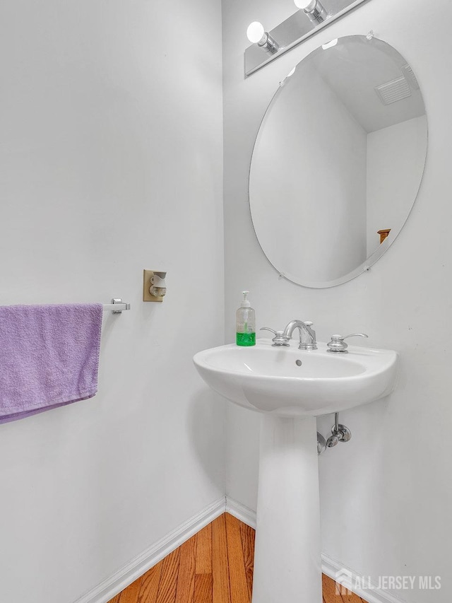 1 Kushnetki Rd, Parlin, NJ 08859 - bathroom with a sink and wood finished floors