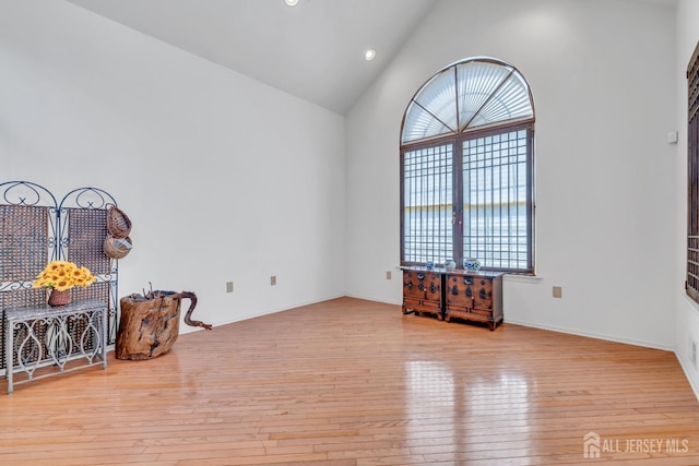 1 Kushnetki Rd, Parlin, NJ 08859 - unfurnished room featuring wood-type flooring, high vaulted ceiling, and recessed lighting