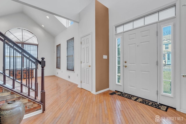 1 Kushnetki Rd, Parlin, NJ 08859 - entryway featuring high vaulted ceiling, light wood finished floors, and stairs