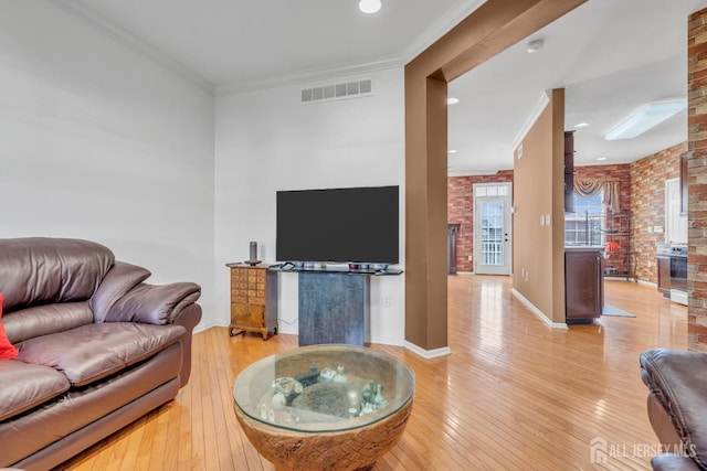 1 Kushnetki Rd, Parlin, NJ 08859 - living room with light wood finished floors, ornamental molding, and brick wall