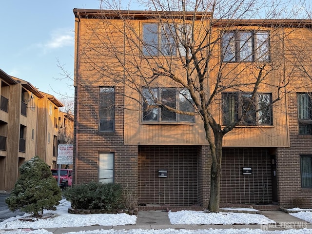 view of front of property featuring brick siding