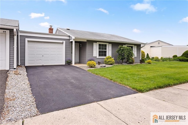 2 Belmar Rd Unit C, Monroe, NJ 08831 - view of front of home featuring a garage, a front lawn, asphalt driveway, and a chimney