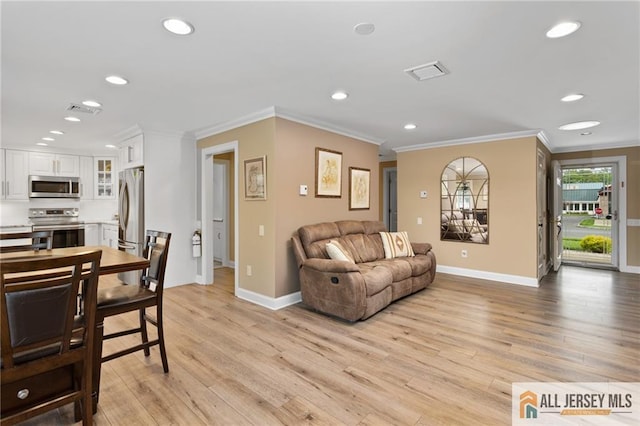 2 Belmar Rd Unit C, Monroe, NJ 08831 - living room with recessed lighting, ornamental molding, baseboards, and light wood-style flooring