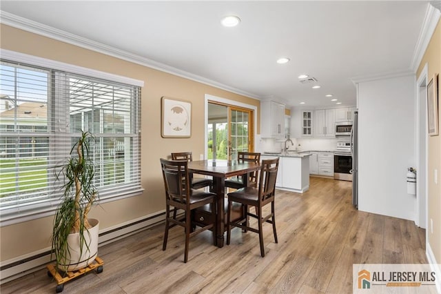 2 Belmar Rd Unit C, Monroe, NJ 08831 - dining room featuring crown molding, light wood-style floors, recessed lighting, and a baseboard heating unit