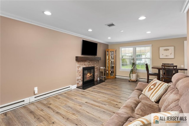 2 Belmar Rd Unit C, Monroe, NJ 08831 - living room with a baseboard heating unit, crown molding, wood finished floors, recessed lighting, and baseboards