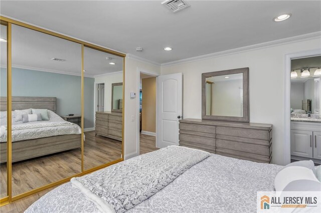 2 Belmar Rd Unit C, Monroe, NJ 08831 - bedroom with wood finished floors, a closet, ornamental molding, recessed lighting, and connected bathroom