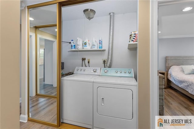 2 Belmar Rd Unit C, Monroe, NJ 08831 - laundry area with washer and clothes dryer, wood finished floors, ornamental molding, and recessed lighting