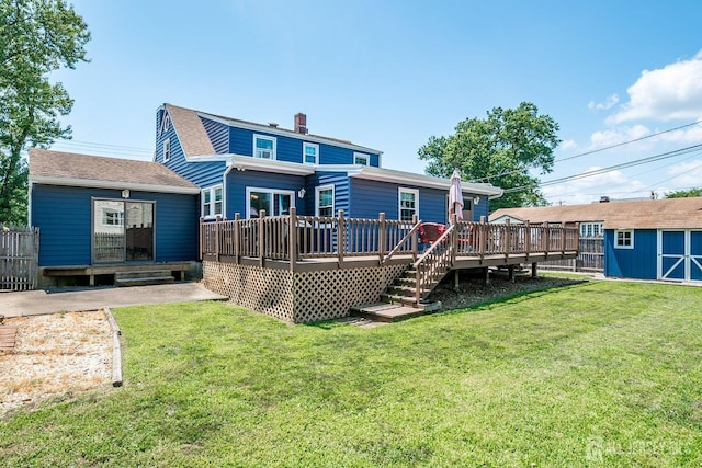 108 Morris Ave, Edison, NJ 08837 - rear view of property featuring a deck, a storage unit, a chimney, and roof with shingles