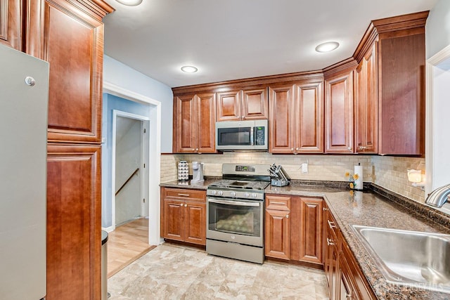 108 Morris Ave, Edison, NJ 08837 - kitchen with stainless steel appliances, decorative backsplash, and brown cabinetry