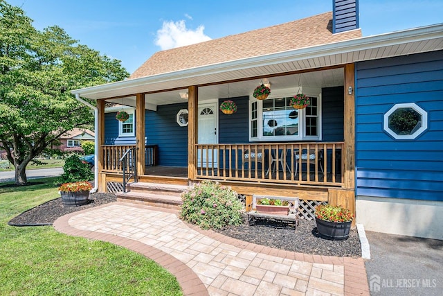 108 Morris Ave, Edison, NJ 08837 - doorway to property with a porch and roof with shingles