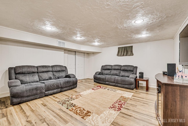 108 Morris Ave, Edison, NJ 08837 - living room with wood finished floors, a textured ceiling, and recessed lighting