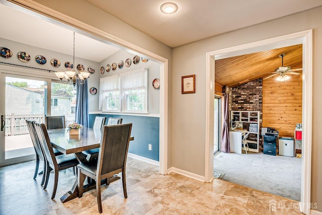 108 Morris Ave, Edison, NJ 08837 - dining room with vaulted ceiling, a chandelier, wood walls, and a ceiling fan