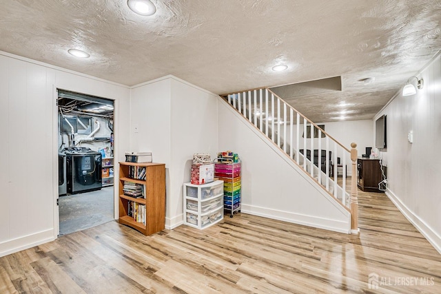 108 Morris Ave, Edison, NJ 08837 - finished basement with stairs, wood finished floors, a textured ceiling, washing machine and clothes dryer, and recessed lighting