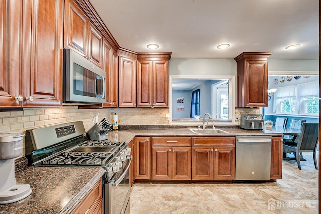 108 Morris Ave, Edison, NJ 08837 - kitchen with stainless steel appliances, decorative backsplash, and brown cabinets