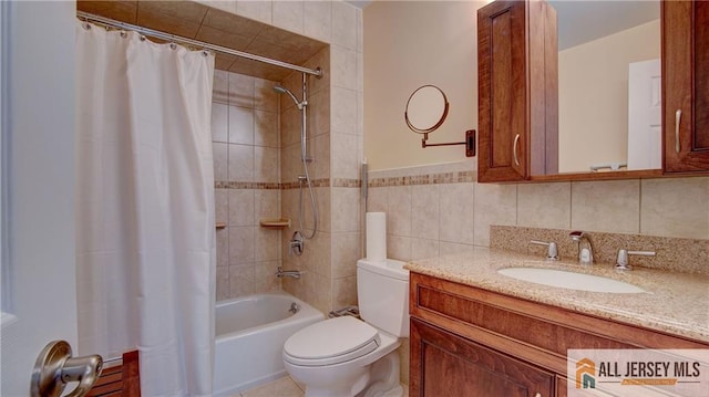 1141 Schmidt Ln, North Brunswick, NJ 08902 - bathroom with shower / bath combination with curtain, tile walls, toilet, and vanity