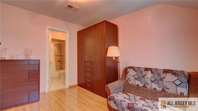1141 Schmidt Ln, North Brunswick, NJ 08902 - sitting room with light wood finished floors and vaulted ceiling